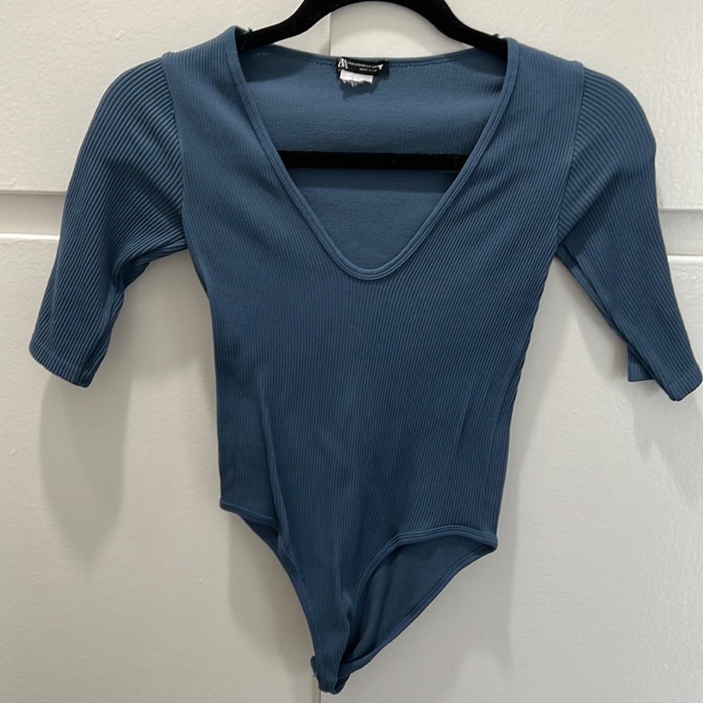 Shirtsleeve body suit